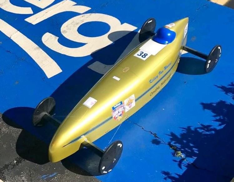 Kelsey Van Waart positioned in soap box derby racing form